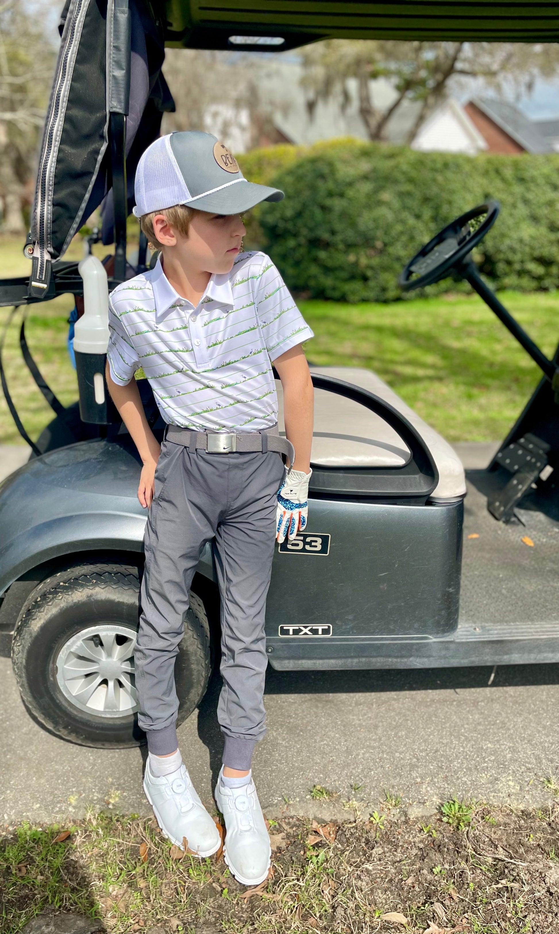 Classy boys golf polo with green and white stripe print